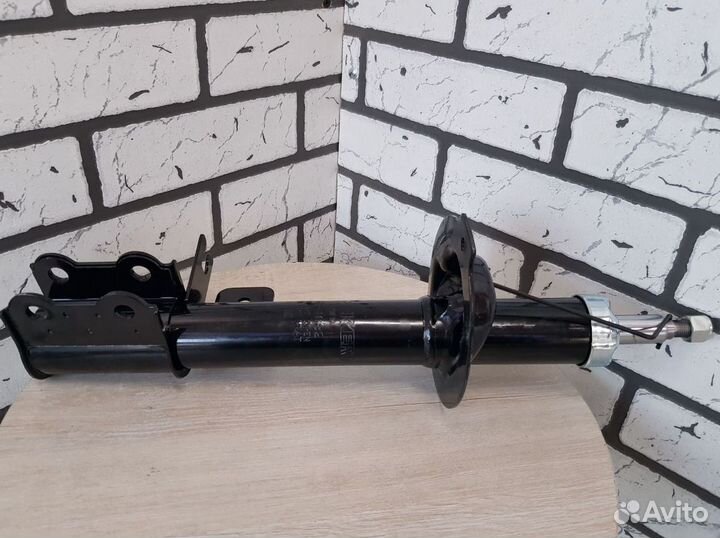 Амортизатор с ABS шевроле перед. левый оригинал