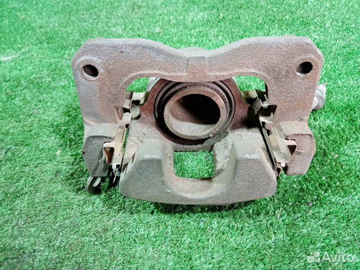 Суппорт тормозной передний левый Suzuki Aerio