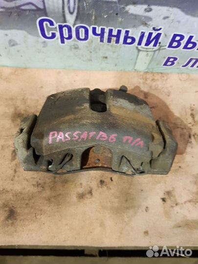 Суппорт передний левый Volkswagen Passat B6