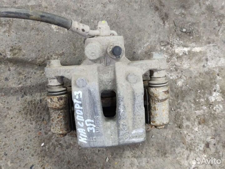 Kia Sportage 3 суппорт задний правый