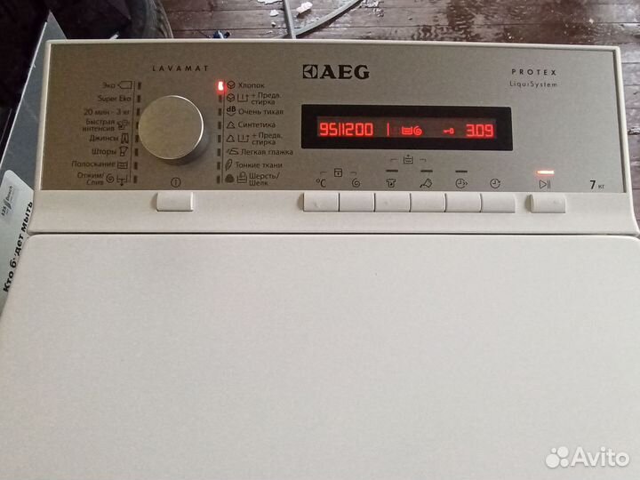 Стиральная машина с вертикальной загрузкой AEG