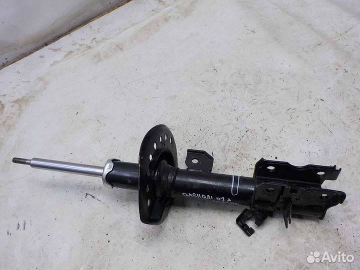 Амортизатор передний левый Nissan Qashqai