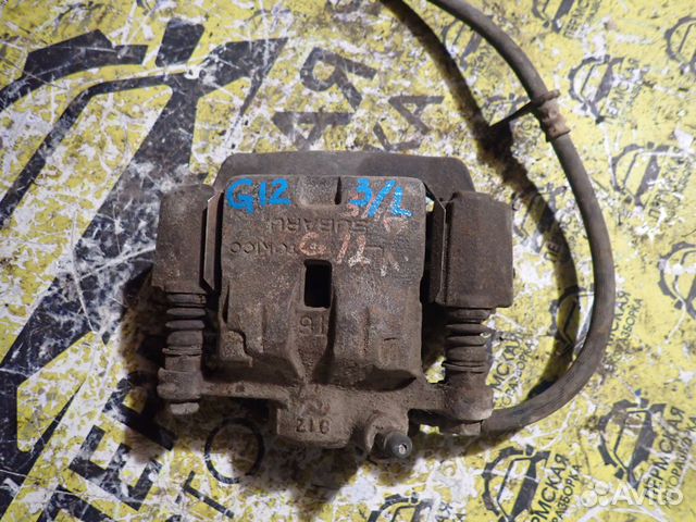 Суппорт тормозной задний левый Subaru Impreza g12