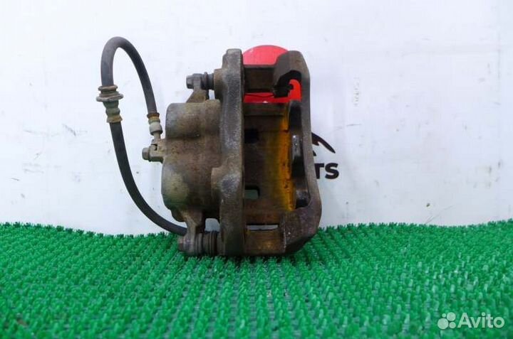 Суппорт тормозной передний левый Nissan X-Trail