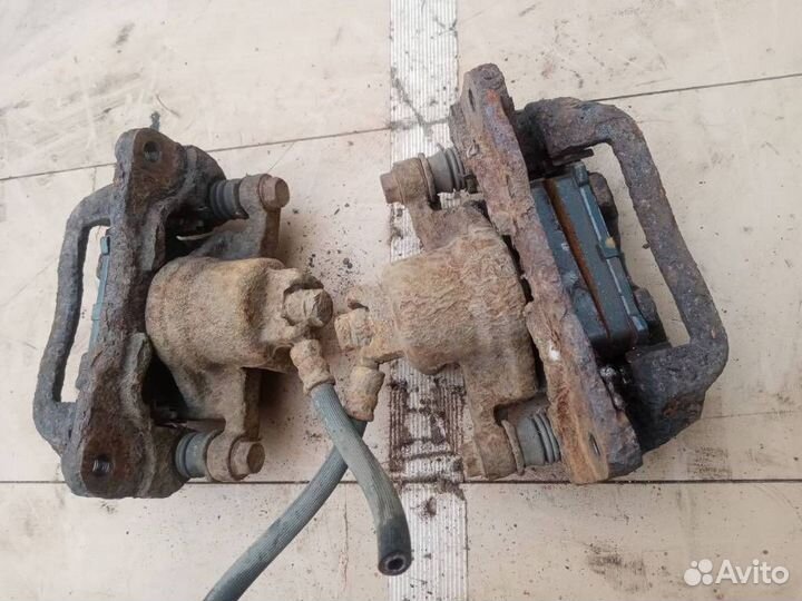 Суппорт тормозной задний Subaru Forester