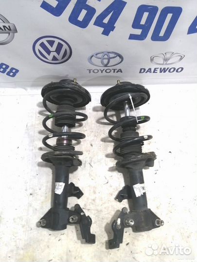 Стойка амортизатора передняя Nissan Primera P12