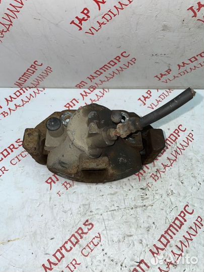 Суппорт тормозной передний левый Mazda 3 BL седан