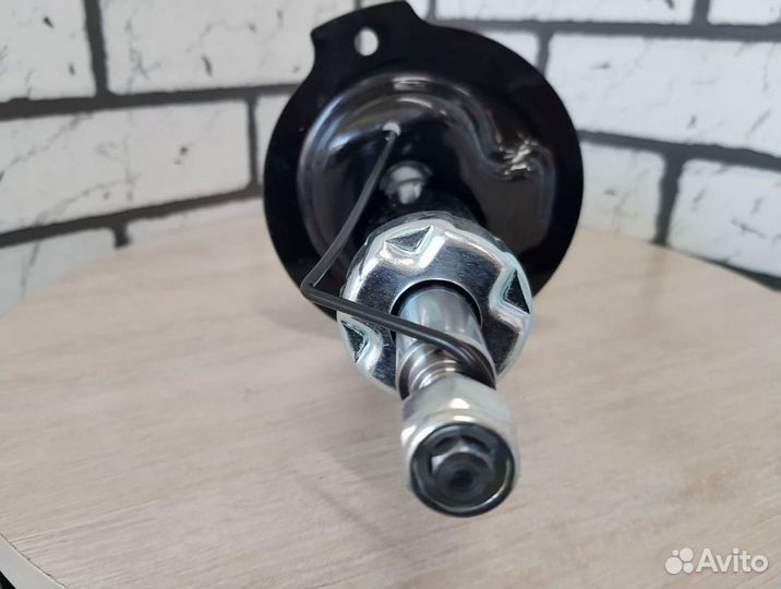 Амортизатор с ABS шевроле перед. левый оригинал