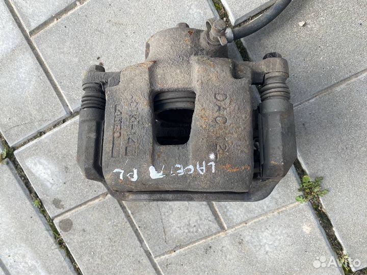 Тормозной суппорт передний левый Chevrolet Lacetti