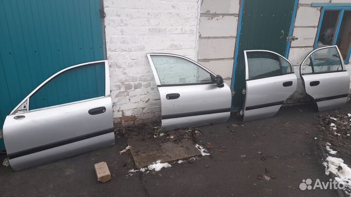 Двери mitsubishi carisma