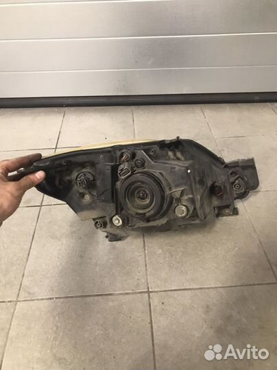 Фара левая передняя mazda demio рестаил