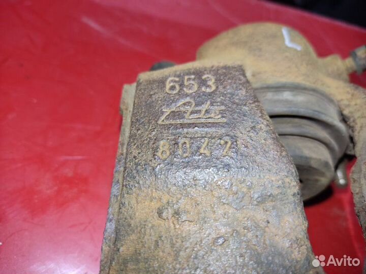 Суппорт тормозной передний левый Opel Astra G