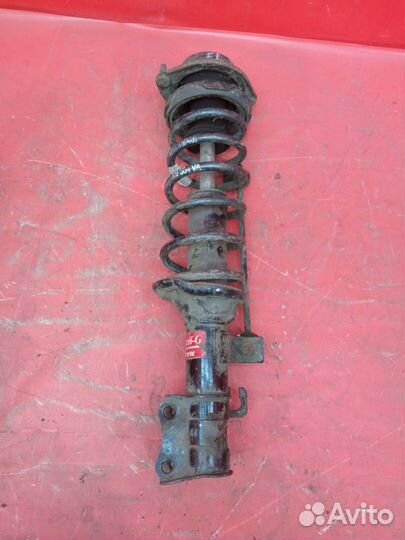 Стойка амортизатора передняя левая Kia Rio 1