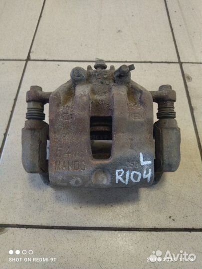Суппорт тормозной передний левый Kia Rio 4