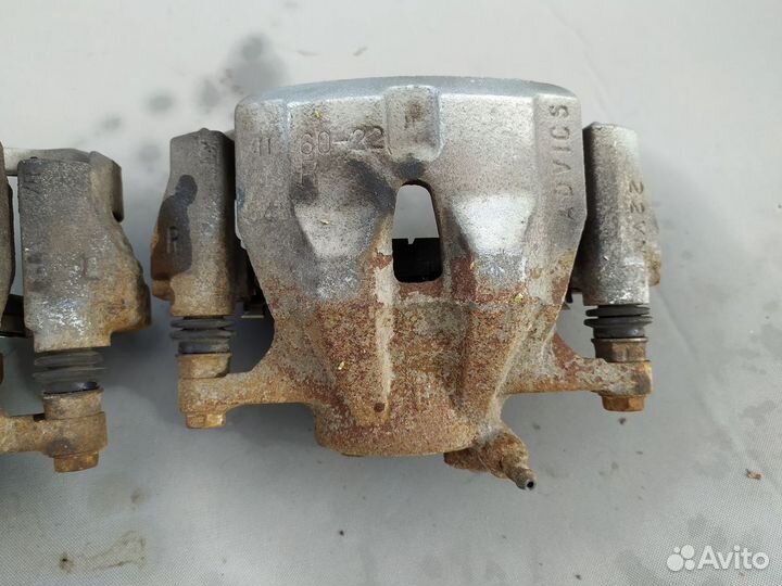 Суппорт тормозной передний Toyota Corolla (E150) X