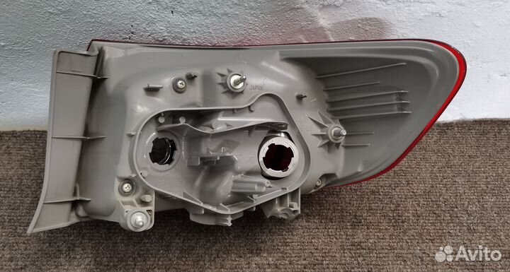 Фонарь левый внешний Toyota Corolla E150