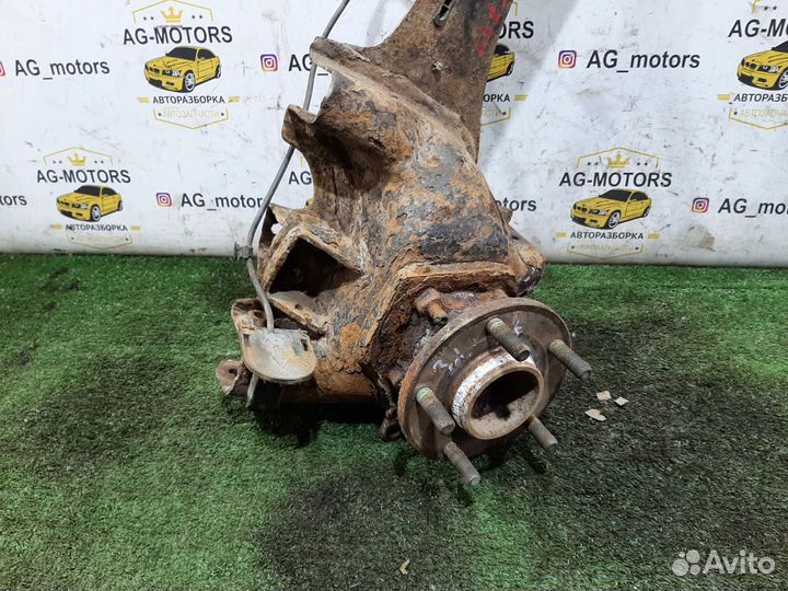 Кулак задний левый Mazda 3 BK седан