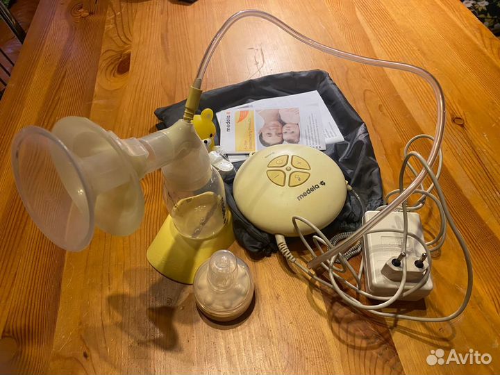 Молокоотсос medela электрический