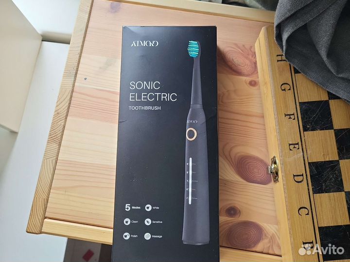 Электрическая зубная щетка