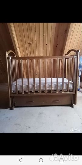 Детская кроватка с маятником и ящиком