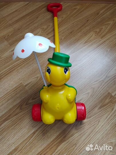 Игрушка каталка с ручкой