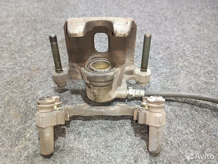 Суппорт тормозной задний правый Mitsubishi Lancer