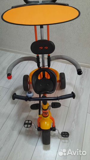 Трехколесный велосипед с ручкой