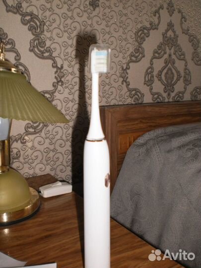 Электрическая зубная щетка