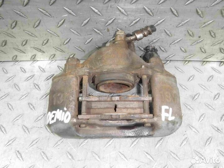 Суппорт тормозной передний левый Mazda Demio