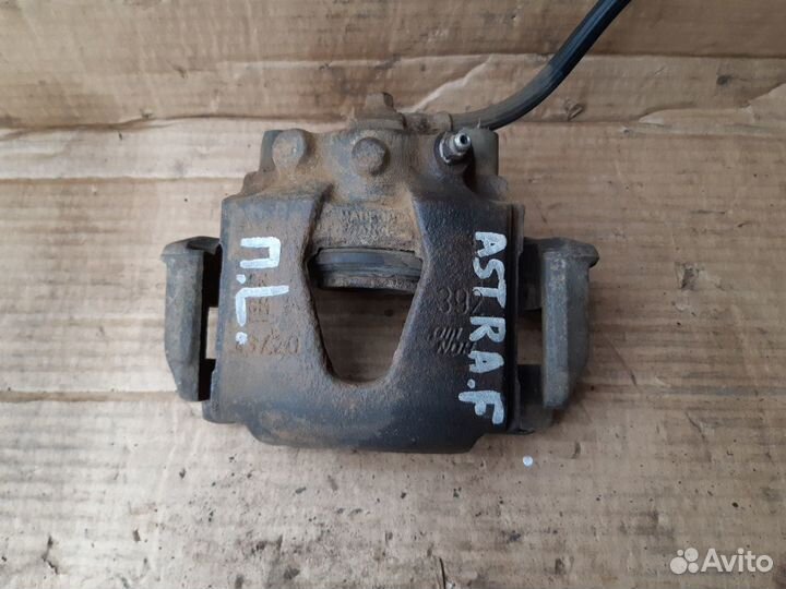 Суппорт тормозной передний Опель Астра Ф