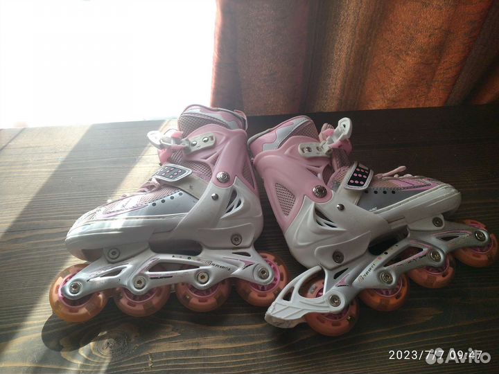 Роликовые коньки