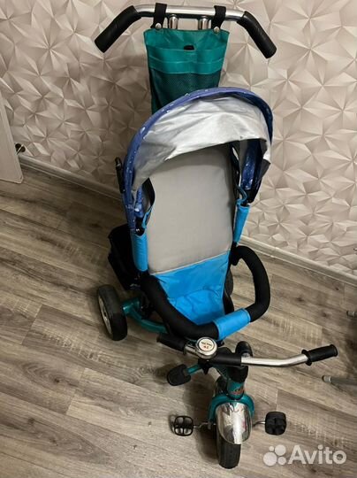 Трехколесный велосипед с ручкой