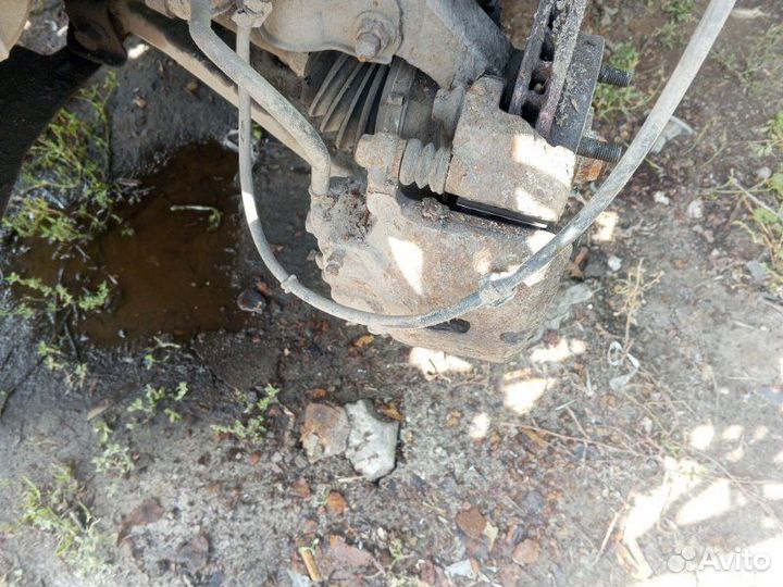 Суппорт тормозной передний левый Mitsubishi Lancer