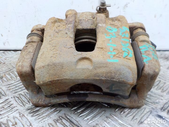 Суппорт тормозной передний левый Kia Rio 2011