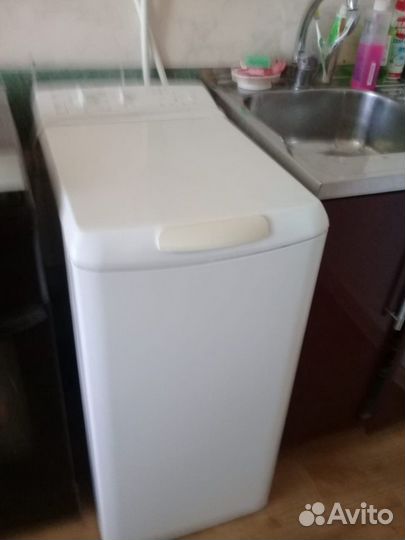 Стиральная машинка Bosh с вертикальной загрузкой