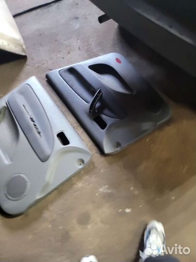 Обшивка карта двери на чери тиго 2010г