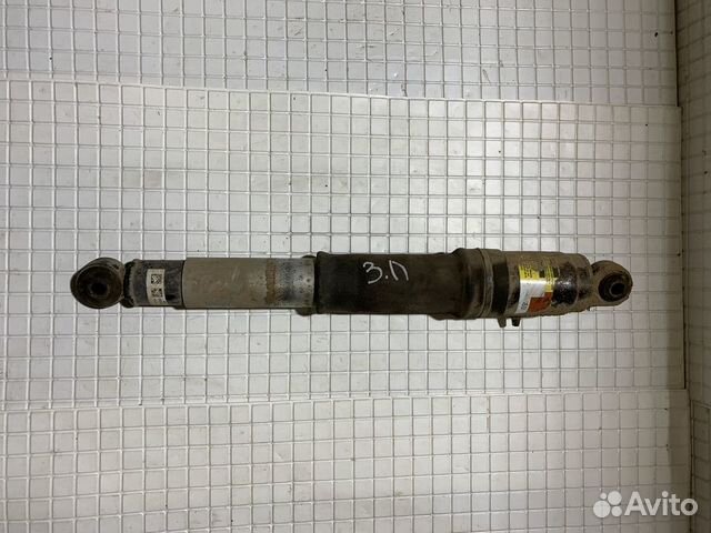 Амортизатор задний левый Cadillac Escalade 3