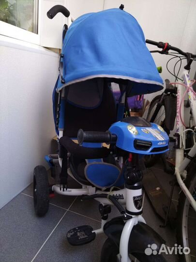 Трехколесный велосипед с ручкой