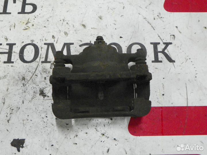 Суппорт тормозной передний правый Nissan X-Trail