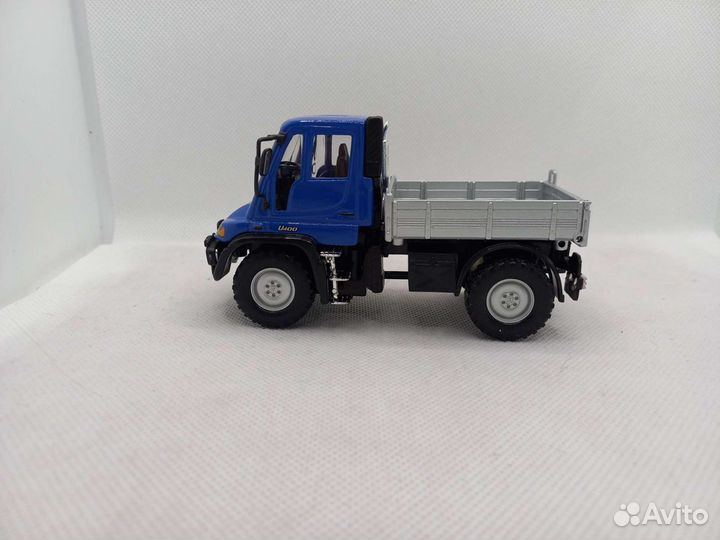 Mercedes Unimog U400,бортовой 1:43 Welly