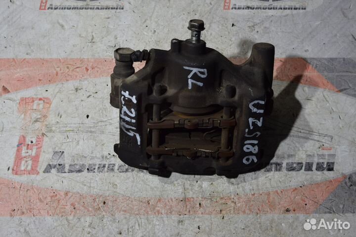 Суппорт зад лево c Toyota Crown Majesta UZS186 3UZ