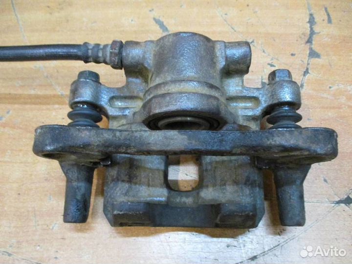 Суппорт задний правый Mitsubishi Lancer 10 (CX, C