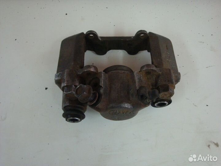 Суппорт тормозной задний левый Chery Tiggo