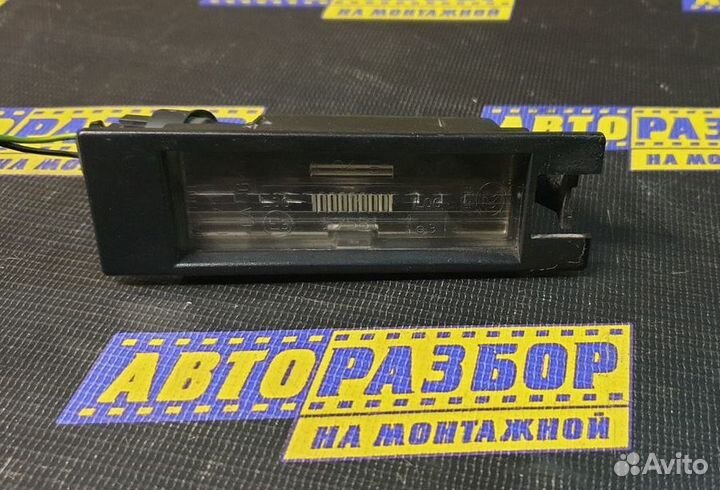 Фонарь подсветки номера Opel Astra