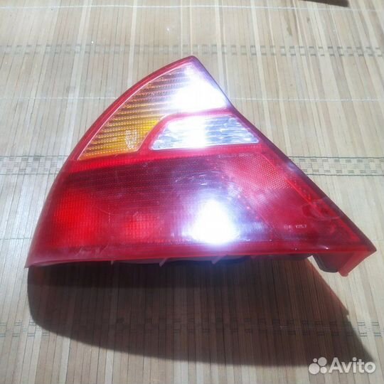 Фонарь заднего хода задний левый Mitsubishi Lancer