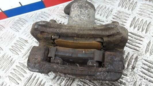 Суппорт тормозной задний левый KIA sportage 3 (ZML