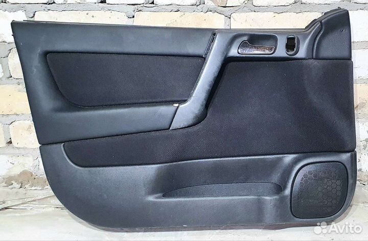 Обшивка двери передней левой Opel Astra G