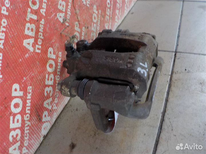 Суппорт тормозной задний левый Hyundai Tucson (W5)