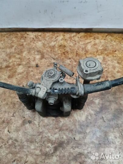 Суппорт тормозной задний левый Opel Astra J