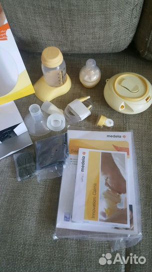 Молокоотсос Medela Swing + смартсoска Calma